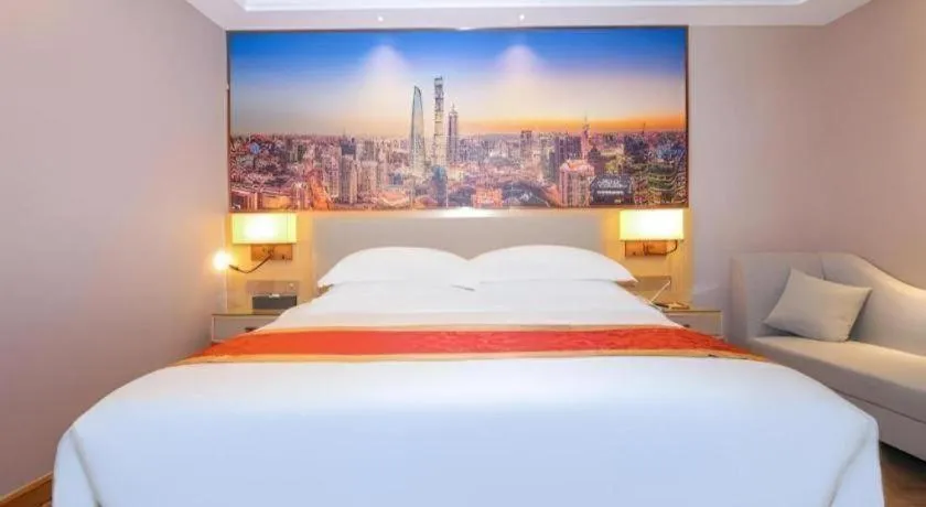 Bed in SHANGJINGHAO HOTEL （SAKATA SNOW ELEPHANT SUBWAY STATION SHOP）