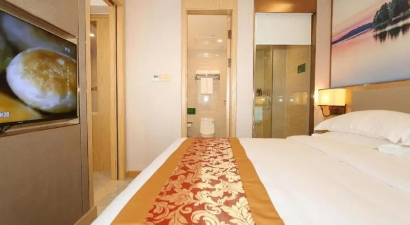 Bed in SHANGJINGHAO HOTEL （SAKATA SNOW ELEPHANT SUBWAY STATION SHOP）