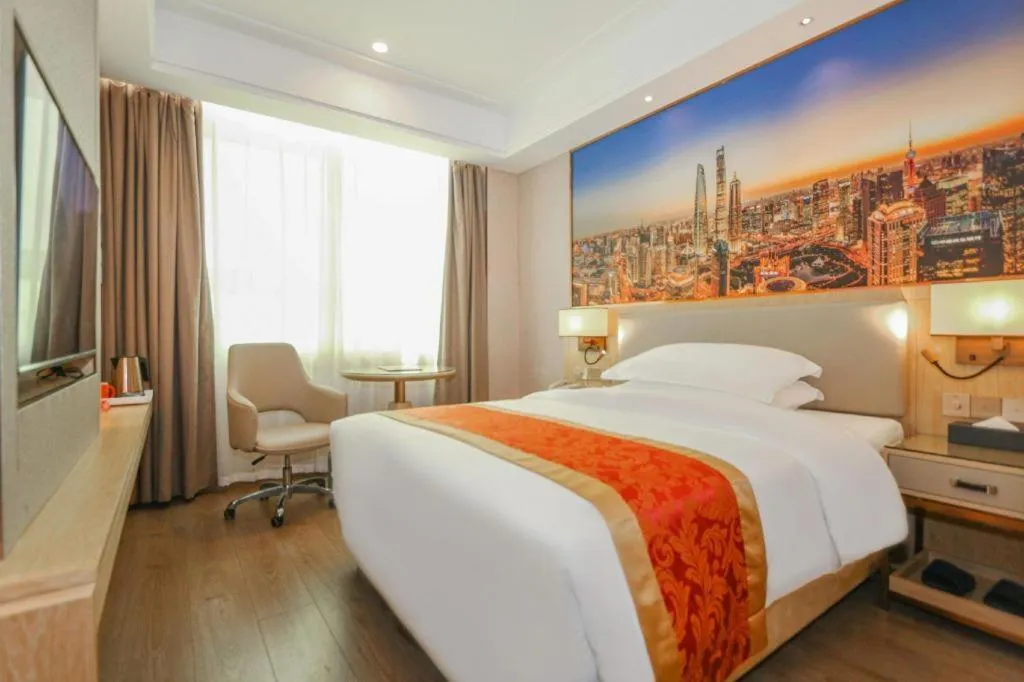 Bed in SHANGJINGHAO HOTEL （SAKATA SNOW ELEPHANT SUBWAY STATION SHOP）