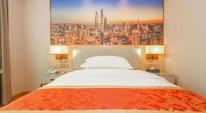 Bed in SHANGJINGHAO HOTEL （SAKATA SNOW ELEPHANT SUBWAY STATION SHOP）