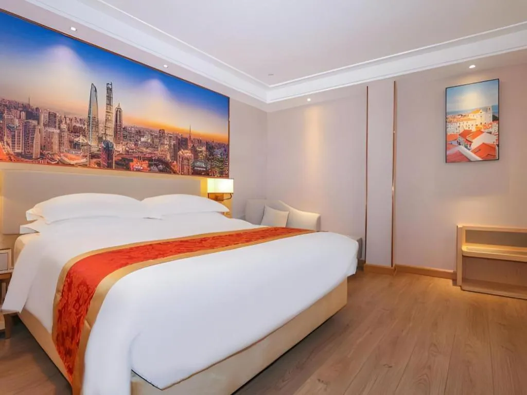 Bed in SHANGJINGHAO HOTEL （SAKATA SNOW ELEPHANT SUBWAY STATION SHOP）