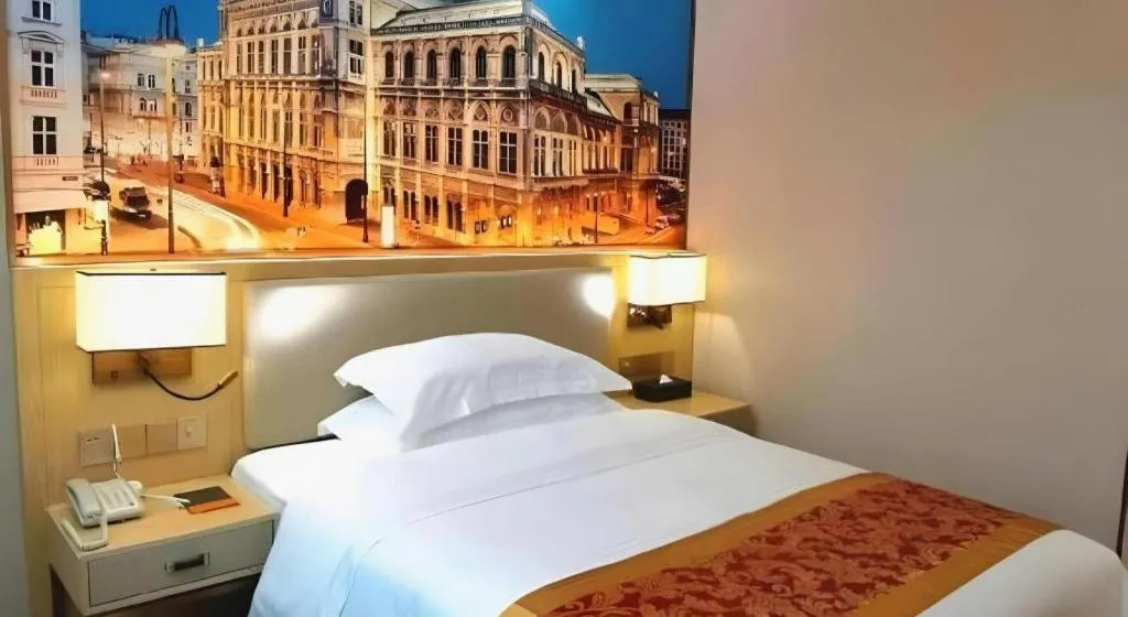 Bed in SHANGJINGHAO HOTEL （SAKATA SNOW ELEPHANT SUBWAY STATION SHOP）