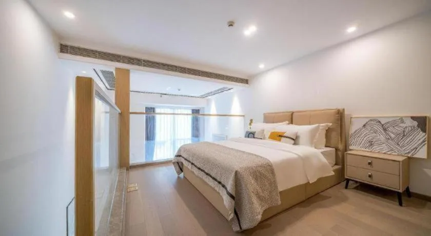 Bed in F-TOWN Fangtang Hotel (Shenzhen Longgang Tian'an Digital City Huanggekeng Subway Station)