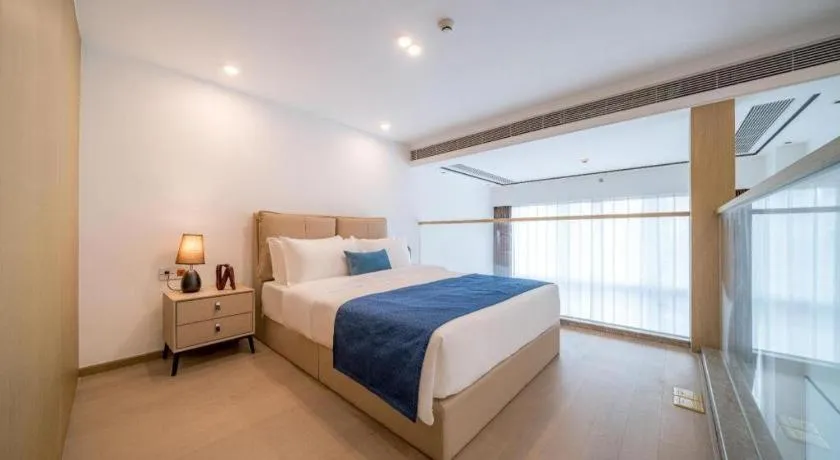 Bed in F-TOWN Fangtang Hotel (Shenzhen Longgang Tian'an Digital City Huanggekeng Subway Station)