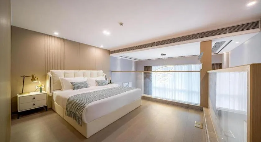 Bed in F-TOWN Fangtang Hotel (Shenzhen Longgang Tian'an Digital City Huanggekeng Subway Station)