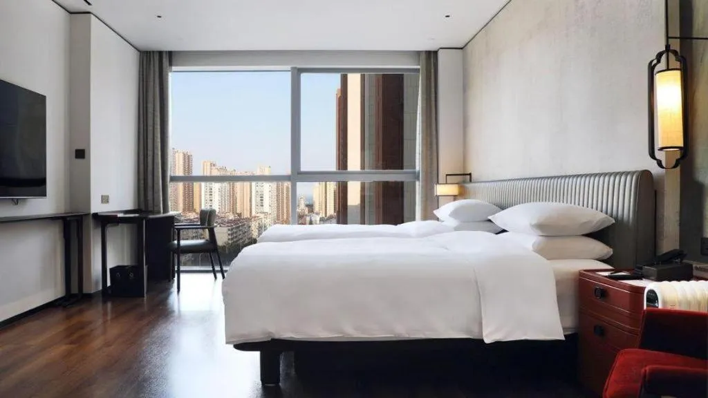 Bed in Mumian Rizhao Hotel