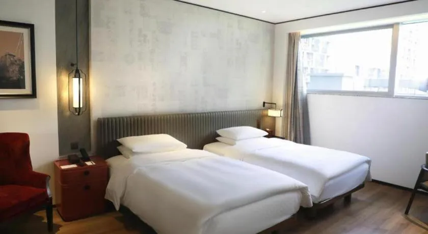 Bed in Mumian Rizhao Hotel