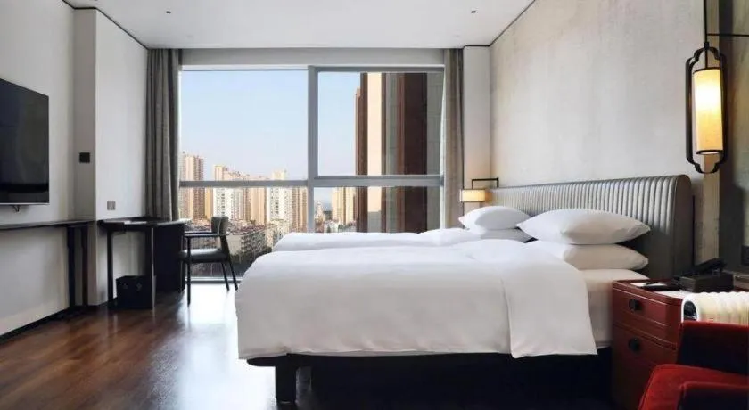 Bed in Mumian Rizhao Hotel