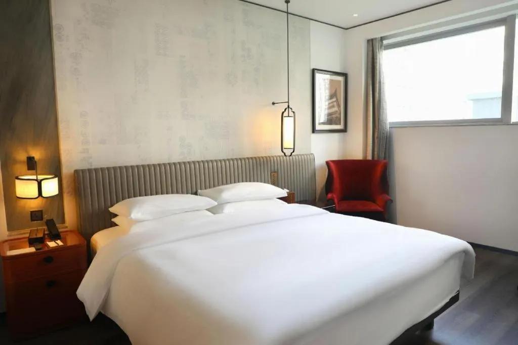 Bed in Mumian Rizhao Hotel