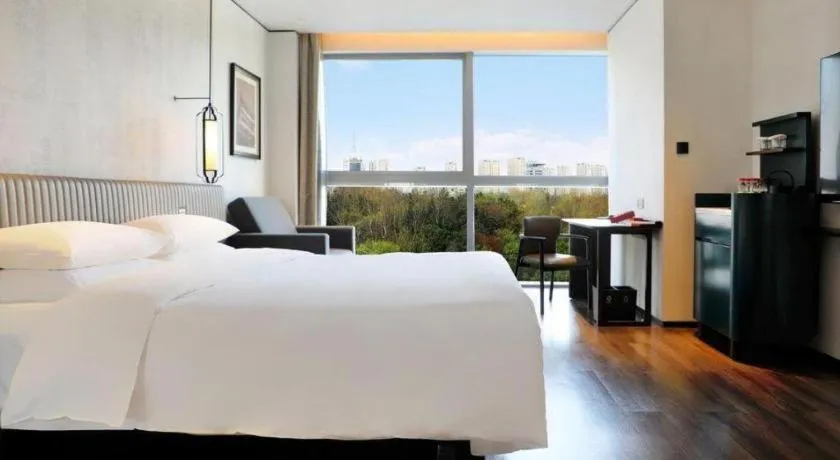 Bed in Mumian Rizhao Hotel