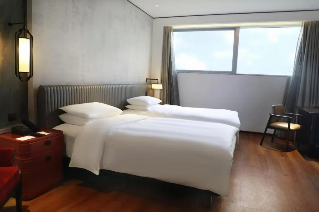 Bed in Mumian Rizhao Hotel