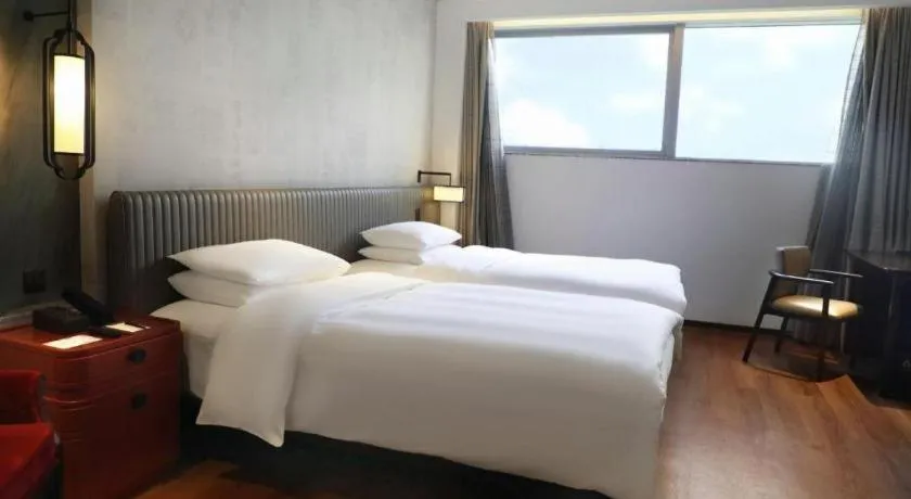 Bed in Mumian Rizhao Hotel