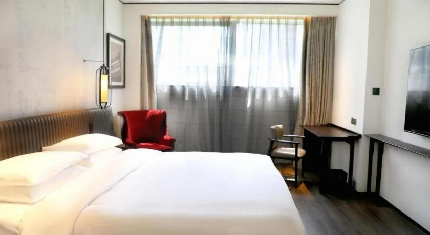 Bed in Mumian Rizhao Hotel