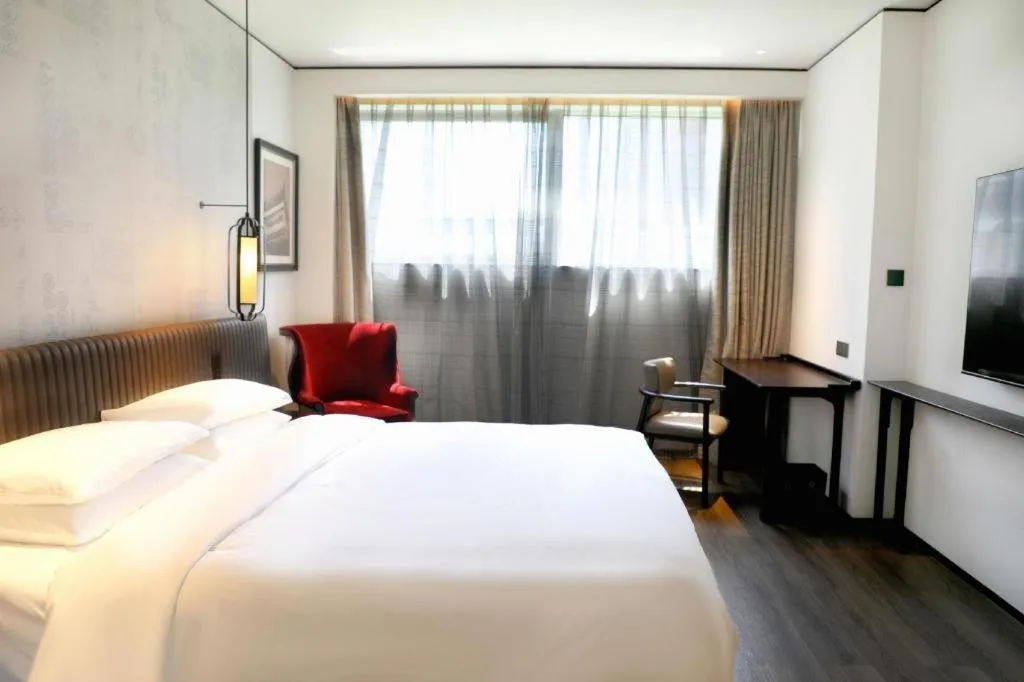 Bed in Mumian Rizhao Hotel