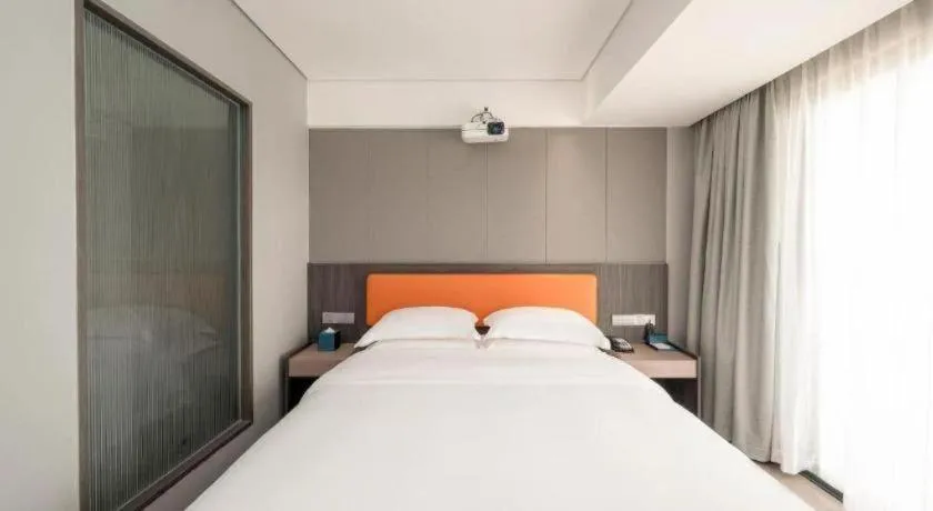 Bed in Echarm Hotel Zhanjiang Zhanchuan Avenue Wanda Plaza