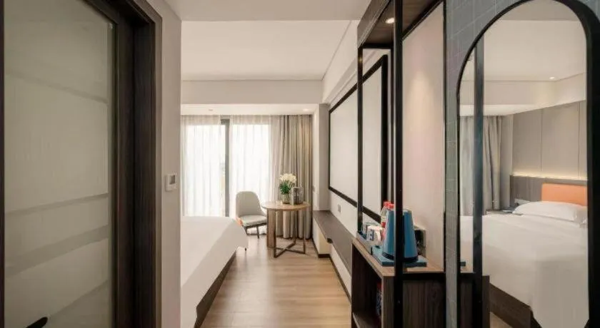 Bed in Echarm Hotel Zhanjiang Zhanchuan Avenue Wanda Plaza