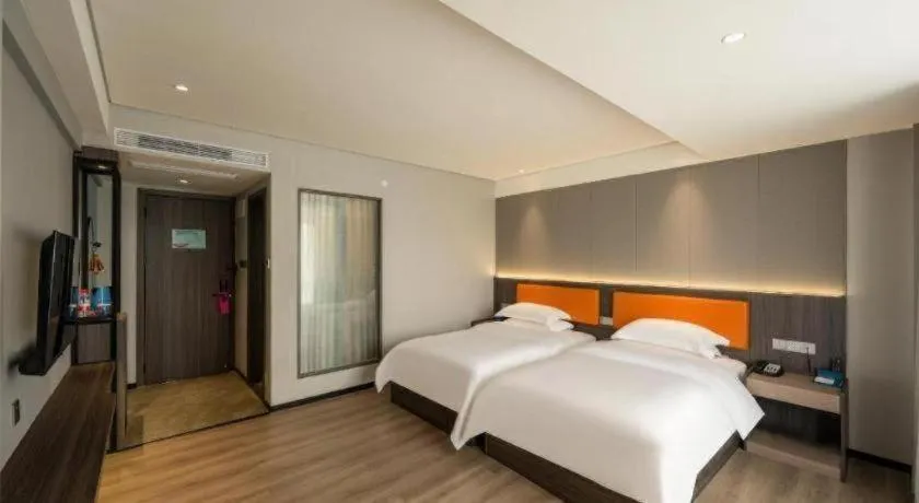 Bed in Echarm Hotel Zhanjiang Zhanchuan Avenue Wanda Plaza