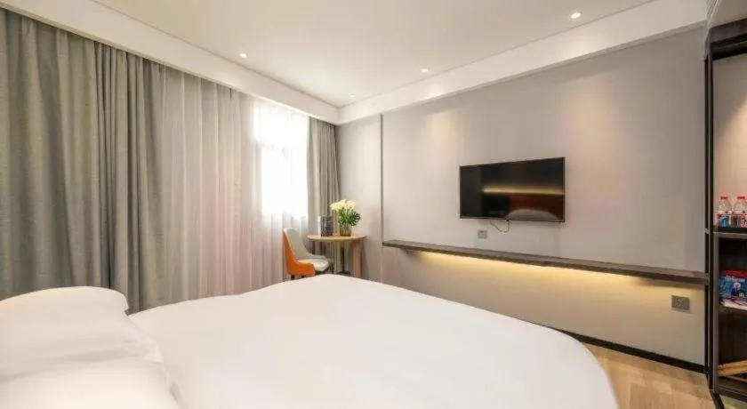 Bed in Echarm Hotel Zhanjiang Zhanchuan Avenue Wanda Plaza