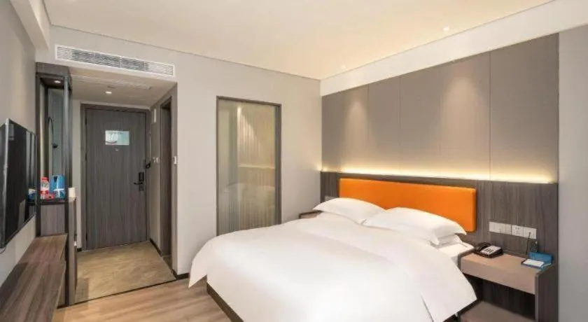 Bed in Echarm Hotel Zhanjiang Zhanchuan Avenue Wanda Plaza