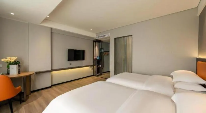 Bed in Echarm Hotel Zhanjiang Zhanchuan Avenue Wanda Plaza