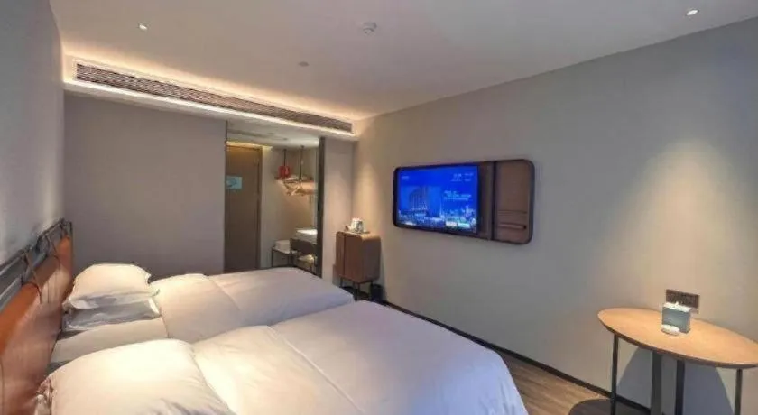 Bed in Echarm Hotel Changsha Huanghua Airport