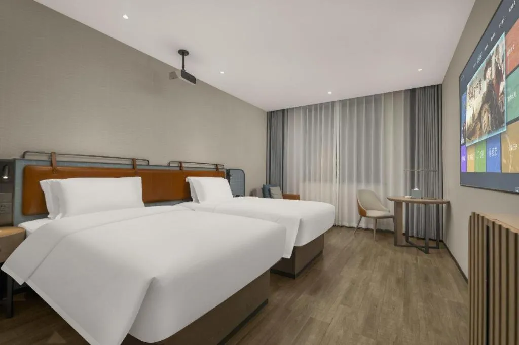 Bed in Echarm Hotel Changsha Huanghua Airport