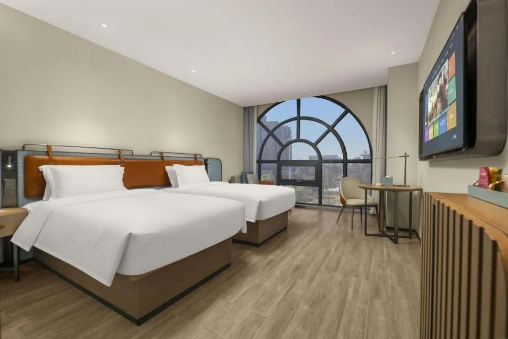 Bed in Echarm Hotel Changsha Huanghua Airport