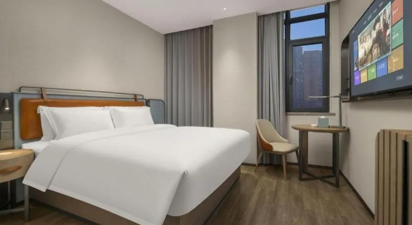 Bed in Echarm Hotel Changsha Huanghua Airport