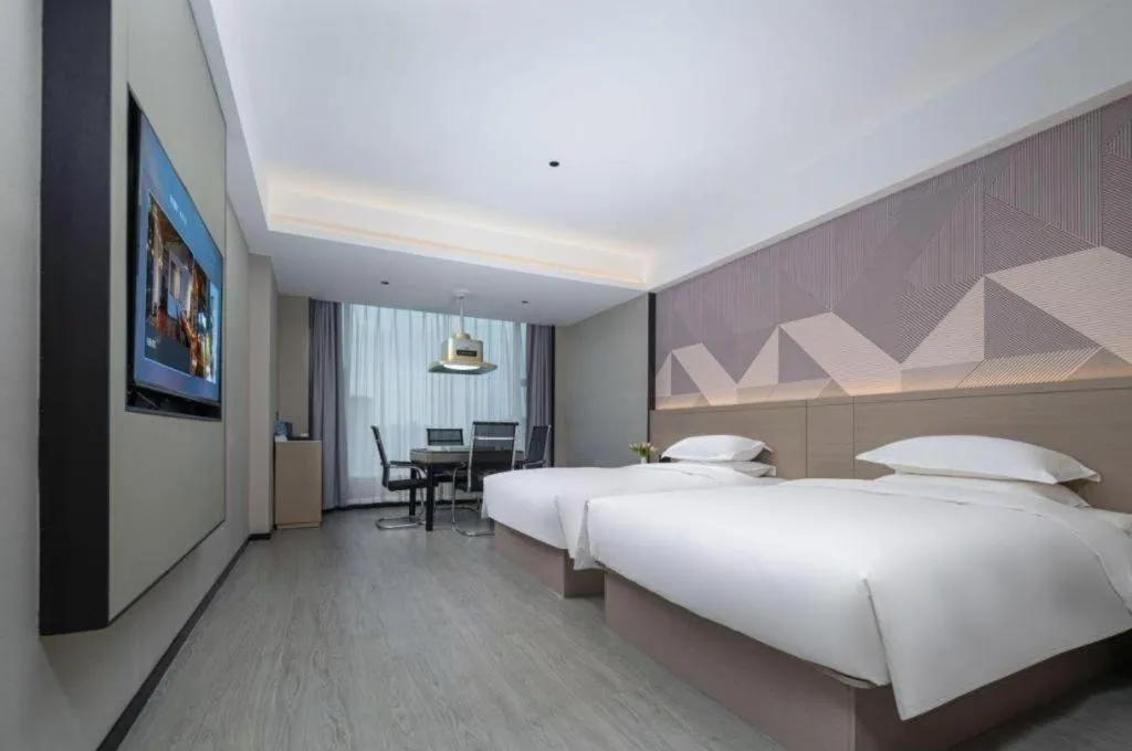 Bed in Borrman Hotel Yongzhou Lingling Ancient Town Government