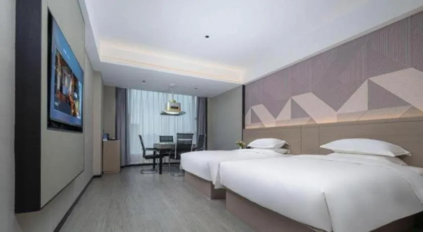 Bed in Borrman Hotel Yongzhou Lingling Ancient Town Government