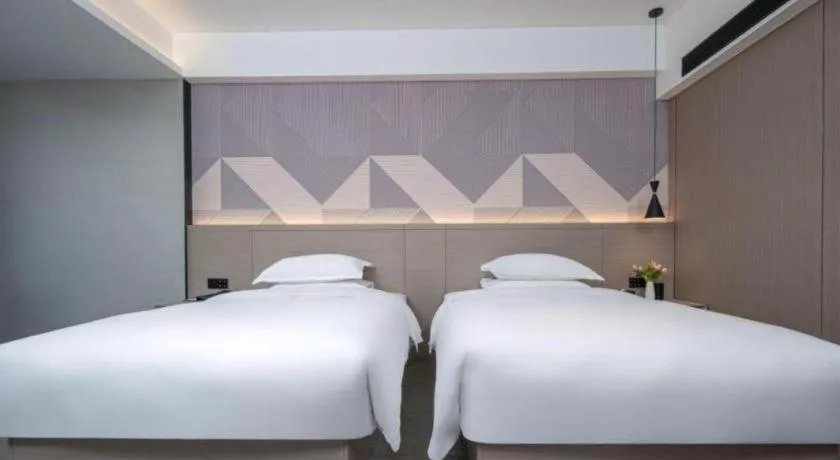 Bed in Borrman Hotel Yongzhou Lingling Ancient Town Government