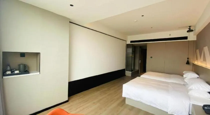 Bed in Borrman Hotel Yongzhou Lingling Ancient Town Government