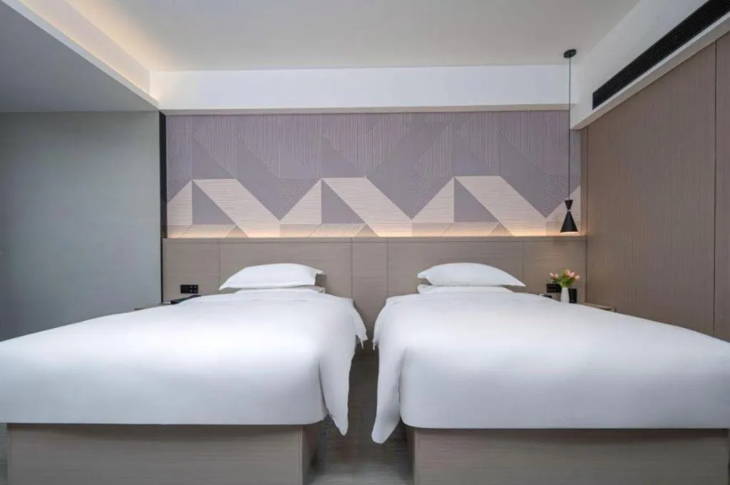 Bed in Borrman Hotel Yongzhou Lingling Ancient Town Government