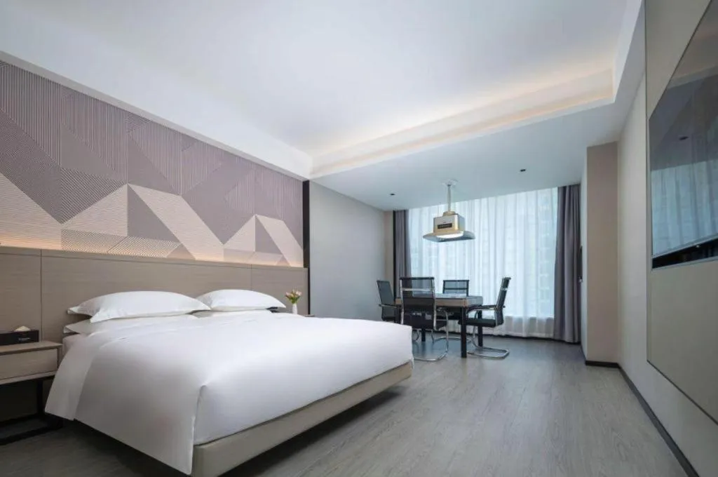 Bed in Borrman Hotel Yongzhou Lingling Ancient Town Government