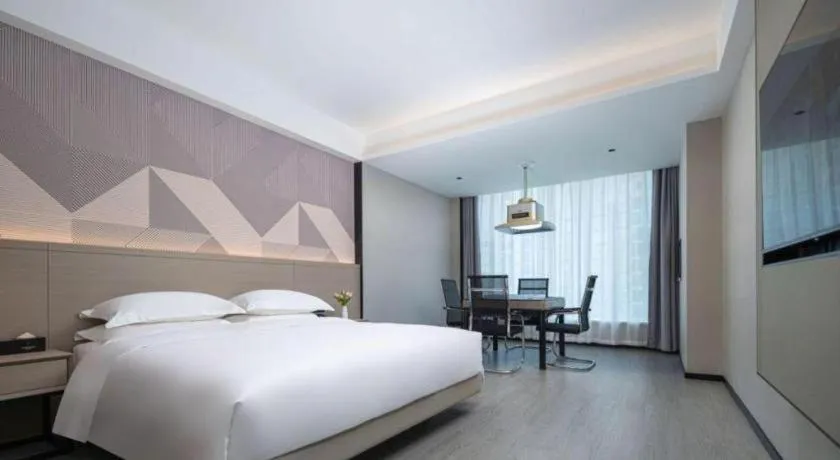 Bed in Borrman Hotel Yongzhou Lingling Ancient Town Government