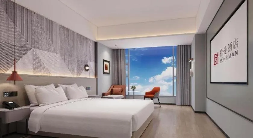 Bed in Borrman Hotel Yongzhou Lingling Ancient Town Government