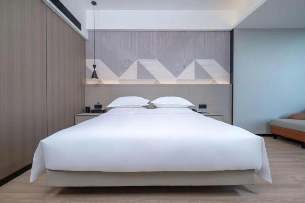 Bed in Borrman Hotel Yongzhou Lingling Ancient Town Government