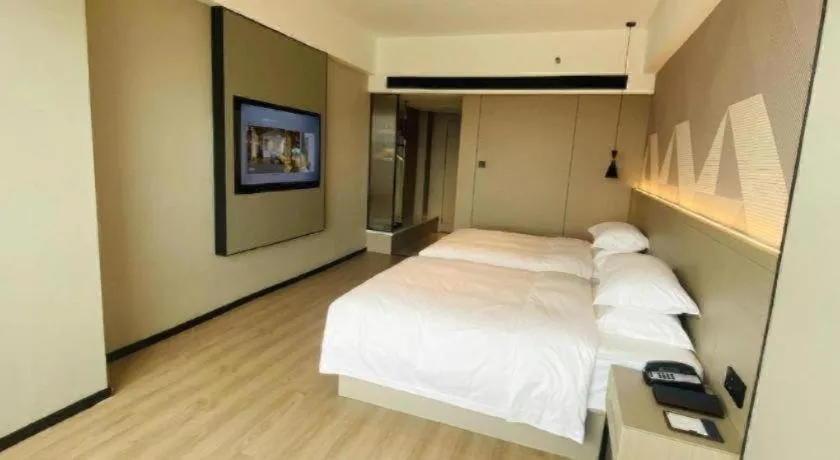 Bed in Borrman Hotel Yongzhou Lingling Ancient Town Government