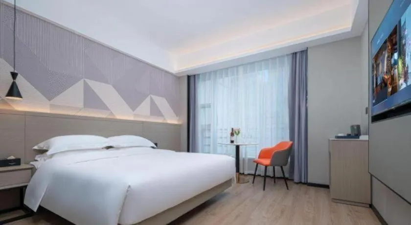 Bed in Borrman Hotel Yongzhou Lingling Ancient Town Government