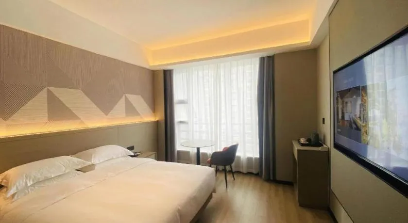 Bed in Borrman Hotel Yongzhou Lingling Ancient Town Government