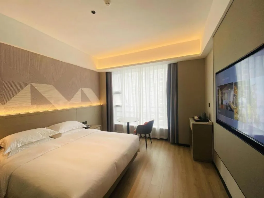 Bed in Borrman Hotel Yongzhou Lingling Ancient Town Government