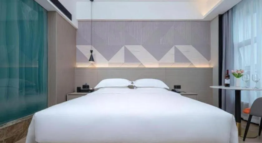 Bed in Borrman Hotel Yongzhou Lingling Ancient Town Government