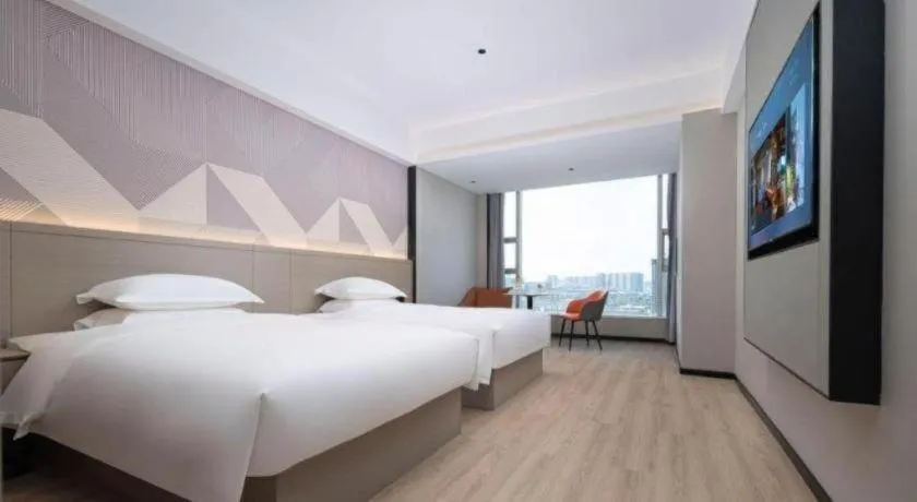 Bed in Borrman Hotel Yongzhou Lingling Ancient Town Government