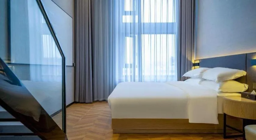 Bed in Borrman Hotel Zhangzhou Baolong Plaza