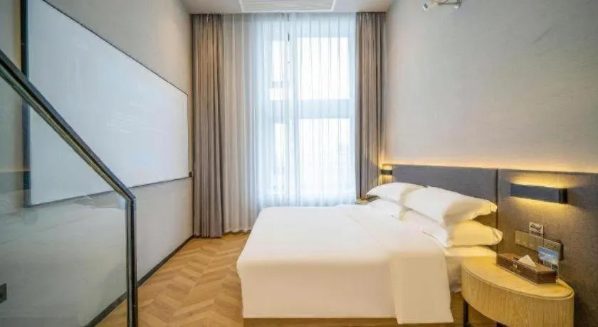 Bed in Borrman Hotel Zhangzhou Baolong Plaza