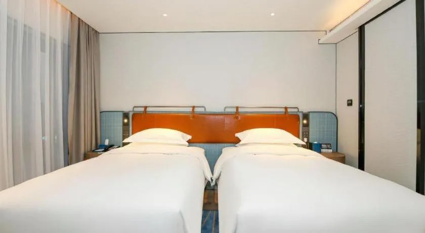 Bed in Echarm Hotel Guangzhou South Railway Station