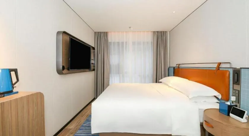 Bed in Echarm Hotel Guangzhou South Railway Station