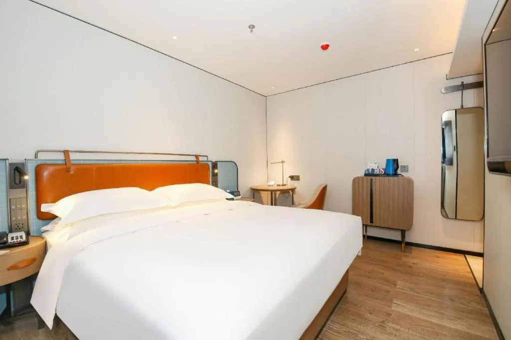 Bed in Echarm Hotel Guangzhou South Railway Station