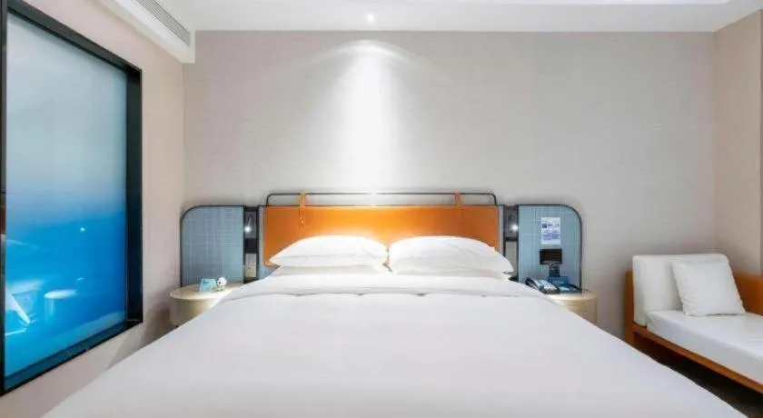 Bed in Echarm Hotel Guangzhou South Railway Station