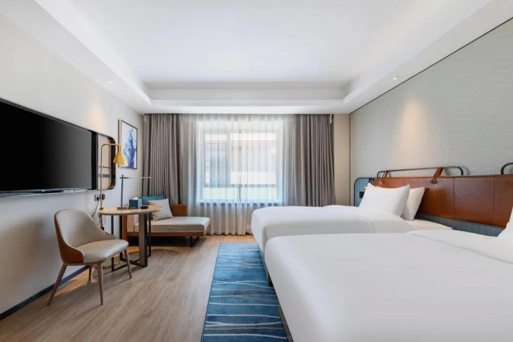 Bed in Echarm Hotel Guangzhou South Railway Station